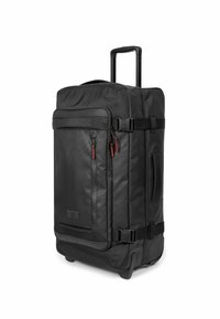 Black wheeled duffel bag made of durable fabric, featuring multiple zippered pockets, a telescopic handle, and reinforced base with wheels.