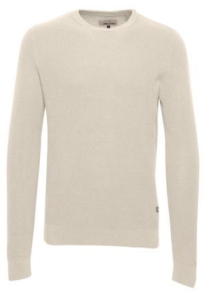 Light beige knit sweater with a crew neckline, long sleeves, and ribbed texture. Features a small brand label on the lower side.
