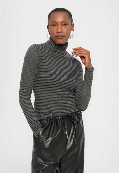 Gray striped turtleneck sweater with long sleeves, made from a fine ribbed material, paired with shiny black high-waisted leather pants.
