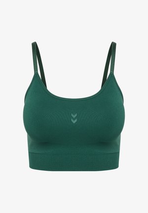 Naadloze donkergroene sportbeha met dunne verstelbare bandjes en geribde onderste band, met twee kleine chevron-symbolen in het midden aan de voorkant.