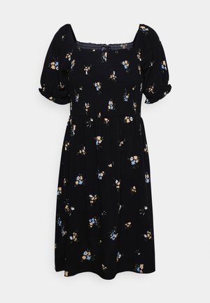 Vestido negro con flores, con mangas cortas abullonadas, escote cuadrado y un corte holgado. Presenta pequeños patrones florales en azul y amarillo.