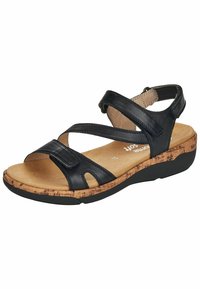 Sandalia de cuero negro con tiras cruzadas, plantilla de corcho y suela de goma texturizada. Diseño abierto con tira trasera ajustable para un mejor ajuste.