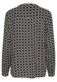 Blusa navy con motivo geometrico crema, maniche lunghe, vestibilità ampia, scollatura tonda e dettagli sulla parte posteriore. Realizzata in tessuto leggero.