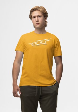 Gul bomulds T-shirt med et hvidt "JT Racing" logo med dynamiske linjer, korte ærmer og rund hals design.