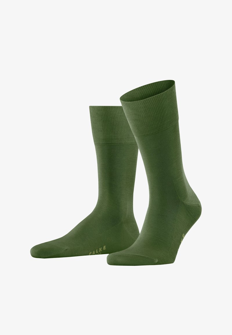 Paire de chaussettes mi-mollet vert olive uni avec bordures côtelées, présentées debout sur un fond blanc.