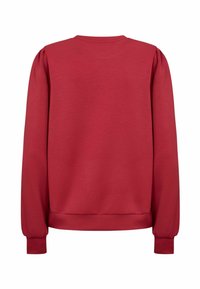 Röd sweatshirt med långa ärmar, ribbade muddar och rundad hals. Tillverkad av mjukt tyg med en slät yta utan mönster.