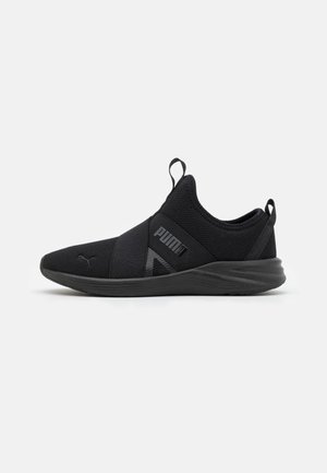 Black slip-on athletic shoe with elastic straps, textured knit upper, and "Puma" logo on side and toe against white background.