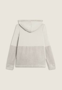 Felpa con cappuccio a maniche lunghe con design bicolore in beige chiaro e crema, mostrata da dietro su uno sfondo neutro.