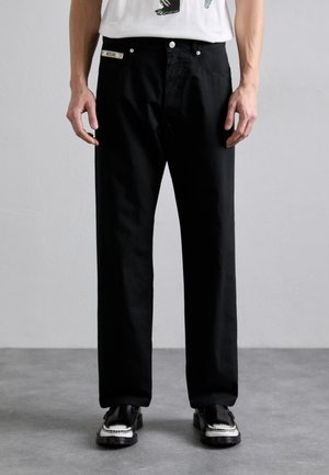 INSTITUTIONAL - Trousers - black
