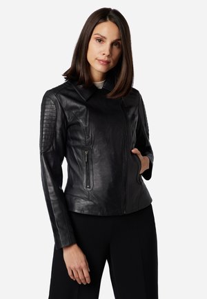 Black leather motorcycle jacket with a zip closure, quilted shoulder accents, and two zippered side pockets. Smooth texture and tailored fit.