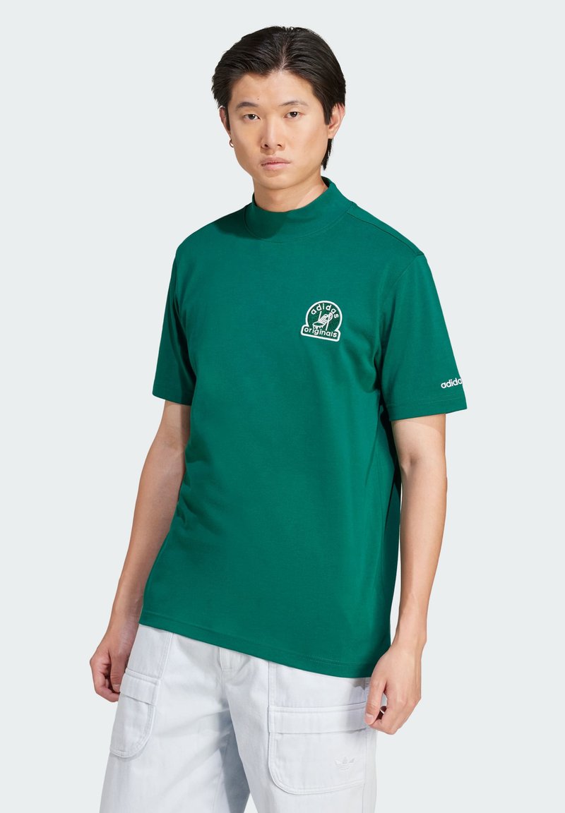 Green short-sleeve t-shirt with a high collar, featuring a white graphic logo on the chest and a small logo on the sleeve. Cotton material.