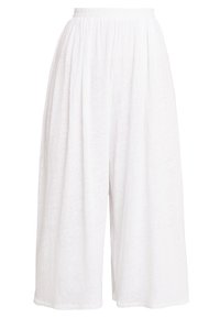 Vita, lätta culotter med elastisk midja, som har en lös passform, strukturerad tyg och vida ben.