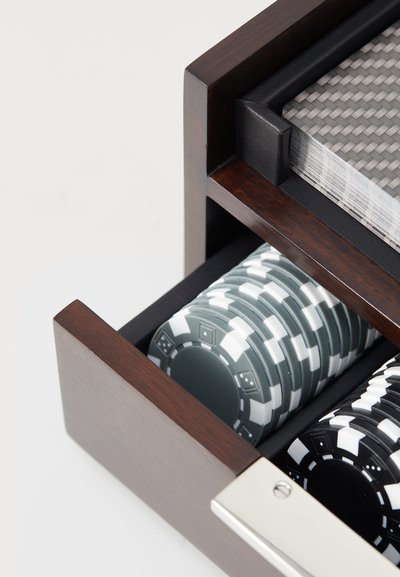 Wooden game box with a black finish; features stacked gray and black poker chips, and a deck of cards with a textured surface.