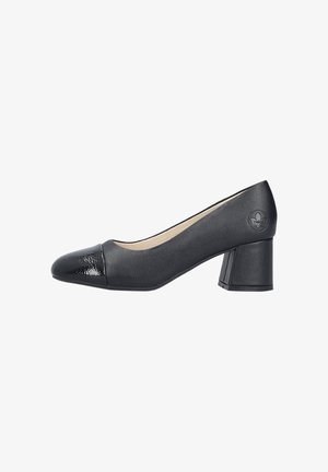 Zapato de tacón medio negro con punta redondeada brillante y logo floral en relieve en el lateral, que presenta texturas de cuero suave y charol.