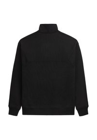 Svart hettegenser med høy krage, laget av teksturert stoff og med detaljert søm bak. Elastiske mansjetter og nedre kant fullfører designet.