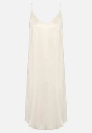 Robe nuisette de couleur crème avec des bretelles fines, un décolleté en V et une coupe décontractée. Fabriquée en tissu léger avec une texture lisse.