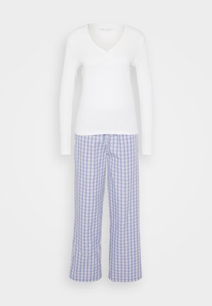 White long-sleeve top with a V-neck and three buttons, paired with blue and white checked wide-leg pants. Cotton material, casual design.