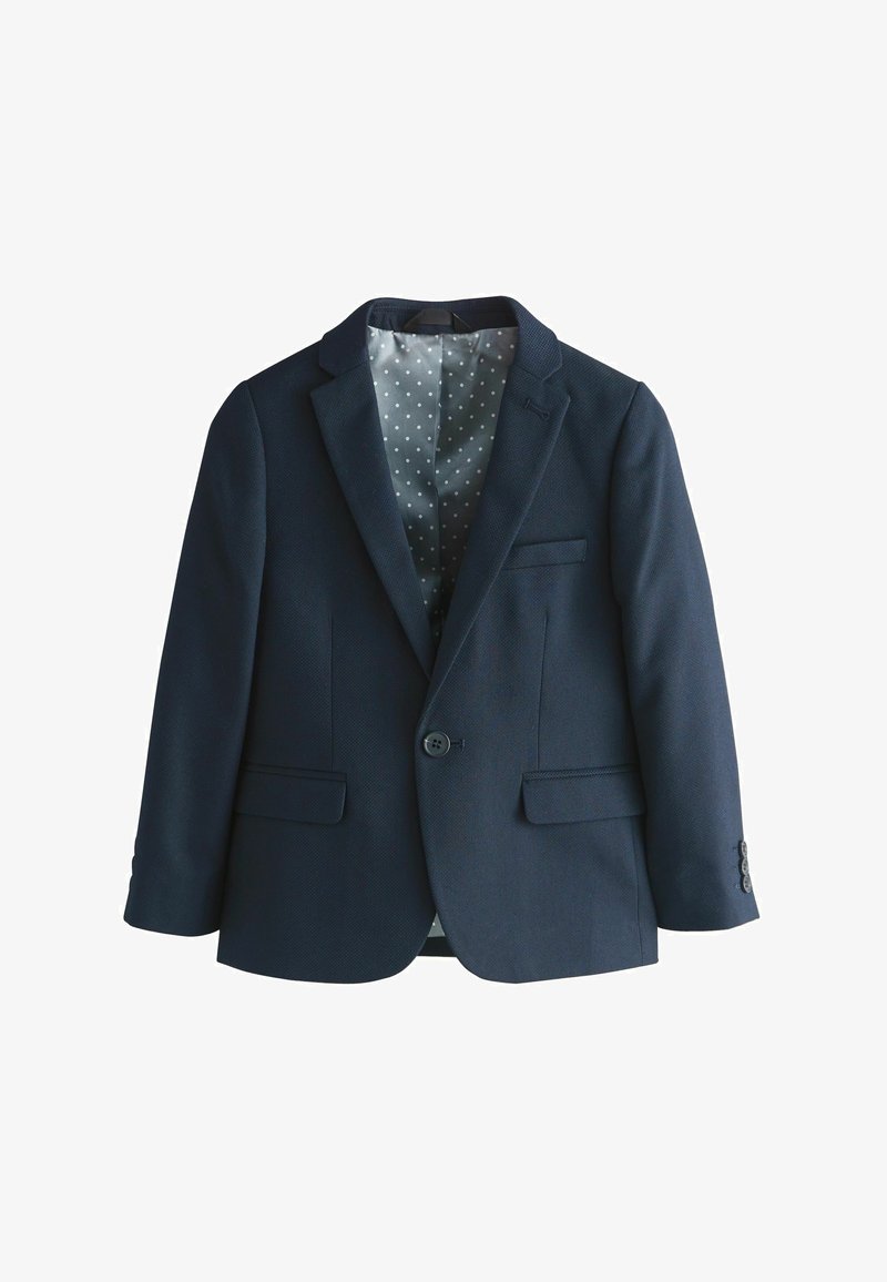 Blazer azul marino de un botón con solapas de muesca, bolsillos con solapa y forro interior de lunares grises.