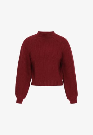 Piros bordázott kötött pulóver magas gallérral, rövidített fazonnal, raglán ujjakkal és strukturált anyaggal. Tiszta, egyszerű vonalak emelik ki a formát.