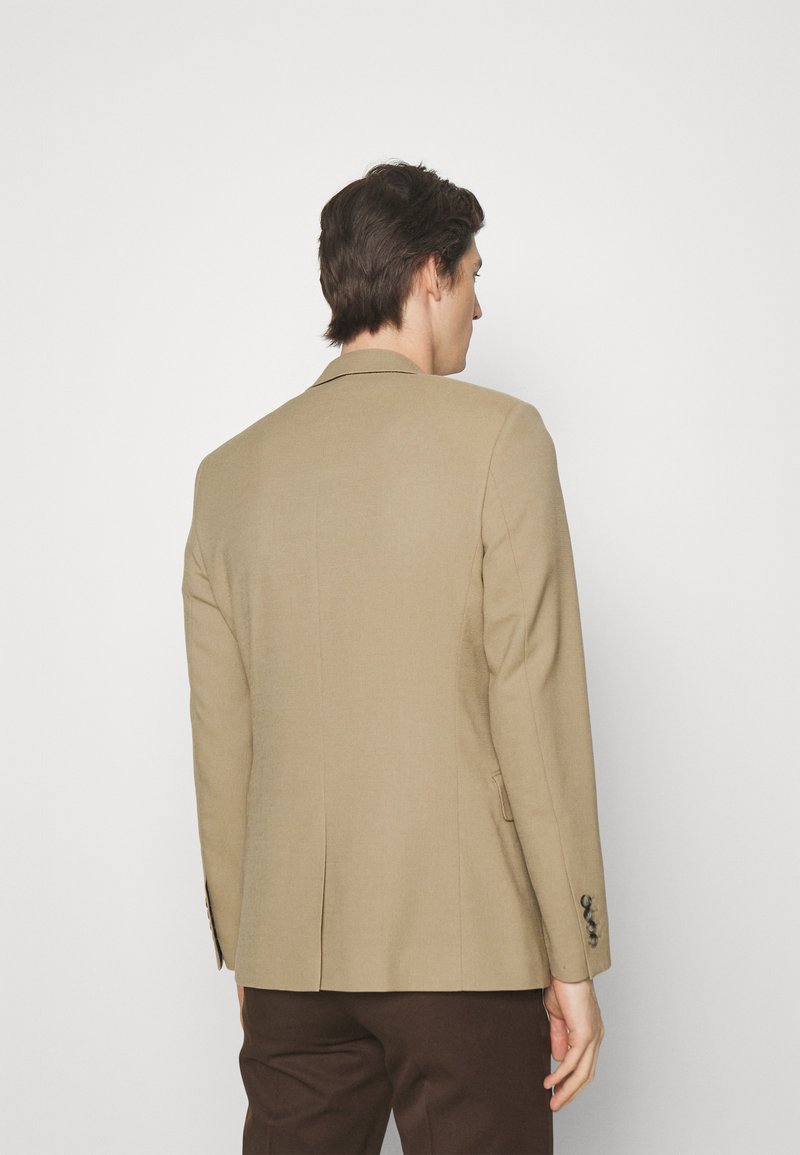 Beige tailored blazer with a single vent, notched lapels, and four-button cuff details, made from a smooth fabric.