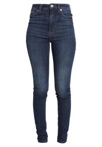 Donkerblauwe skinny jeans met hoge taille, gladde textuur, subtiele vervaging, traditioneel ontwerp met vijf zakken en metalen knoopsluiting.