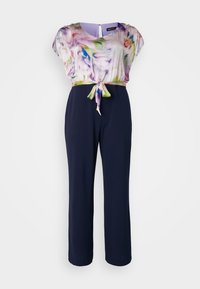 Combinaison à motif floral avec un bas bleu marine, présentant un cordon à la taille, des manches courtes et une texture de tissu lisse.