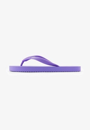 Purple flip-flop made of rubber. Features a thin Y-shaped strap and a textured sole with a wave pattern. Flat design for comfort.