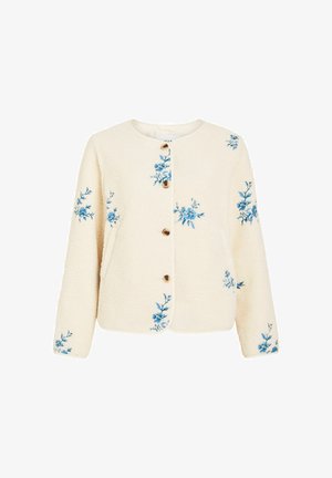 Kremowa kurtka na guziki o fakturze kremowej, z niebieską kwiatową aplikacją rozproszoną na rękawach i przodzie, z okrągłym dekoltem i długimi rękawami.
