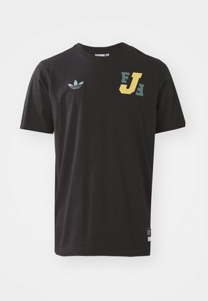 Black cotton t-shirt featuring a green and yellow graphic print, with a small Adidas logo on the left chest and a tag on the bottom hem.