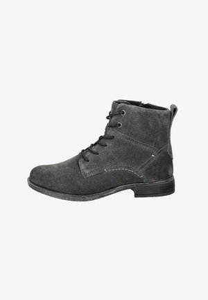 Stivaletti alla caviglia in suede grigio con punta arrotondata, lacci neri e cuciture a contrasto. Presentano un piccolo tacco e una cerniera su un lato.