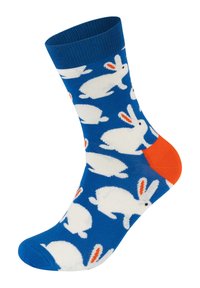 Blue ankle sock featuring white rabbits with orange accents on the heel. The fabric is smooth and stretchy with a ribbed cuff.