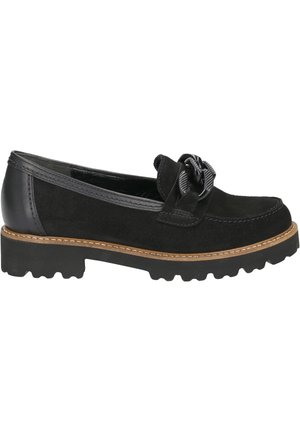 Black suede loafer with chunky sole, tan stitching, and decorative black buckle on top, shown from the outer side.