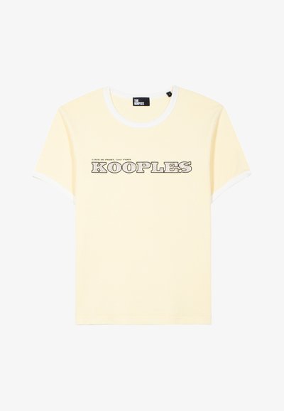 Light yellow short-sleeve T-shirt with white trim on collar and sleeves, featuring "KOOPLES" text and Paris address in black on front.