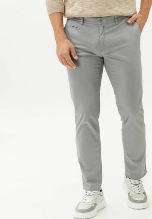 Gray cotton blend chinos with a slim fit, featuring a button closure, front pockets, and a smooth texture, paired with white sneakers.