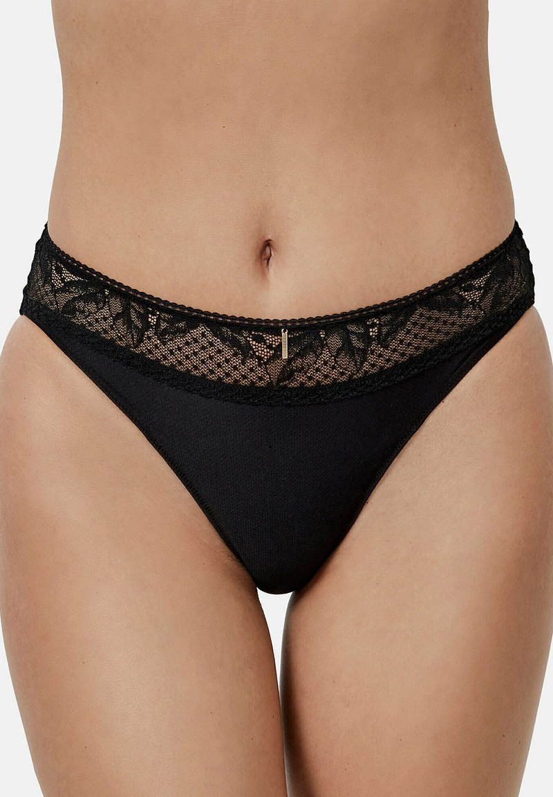 Culotte de bikini noire avec une ceinture en dentelle à motifs floraux, un corps en tissu lisse et un petit détail métallique.