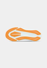 Shoe sole with a white base and orange traction patterns. Features grooves and cutouts for flexibility and grip, designed for performance.