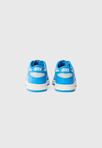 Blue Nike sneakers with a smooth leather and mesh upper, white branding, patterned outsole, and padded collars for comfort.