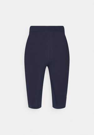 Navyblauwe fietsshorts gemaakt van rekbare stof, met een brede tailleband en net onder de knie reikend met een gladde textuur.
