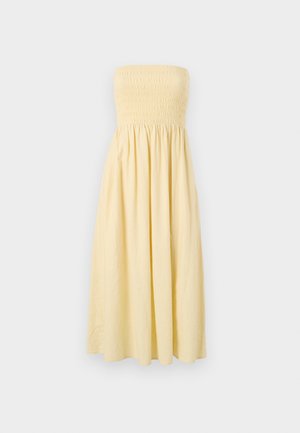 Strapless yellow dress with a smocked bodice and a flowing, A-line skirt, made of lightweight fabric, features a solid color and no patterns.