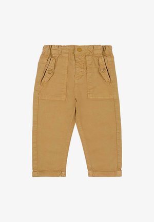 Beżowe spodnie z elastycznym pasem, dwoma przednimi kieszeniami i gładką bawełnianą fakturą. Na dole nogawki są zwinięte, co zapewnia dopasowanie w kształcie stożka.