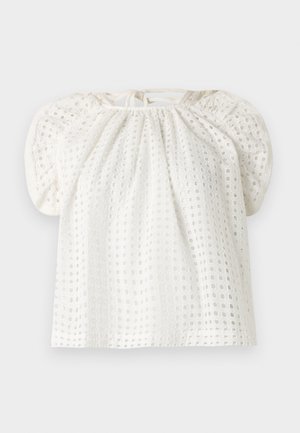 Blouse en tissu œillet blanc avec manches bouffantes, encolure froncée et détail de lien au dos.