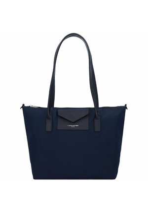 Navy blue tote bag made of durable fabric with a smooth texture, featuring dual handles and a zipper closure. Notable flap with logo.