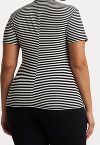 Black and white striped t-shirt with short sleeves, a fitted design, and ribbed texture, featuring a round neckline and back seam detail.