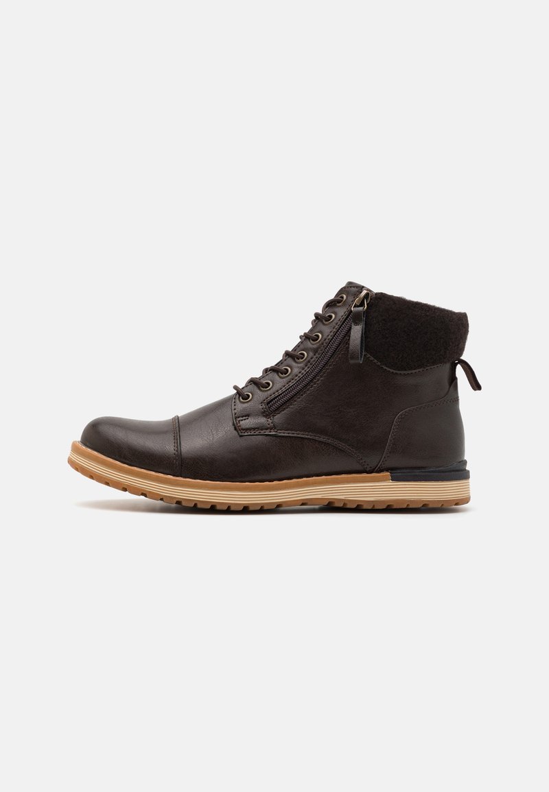 Brown leather ankle boot with a textured collar, round toe, lace-up front, and rubber sole featuring a contrasting light brown strip and zipper.