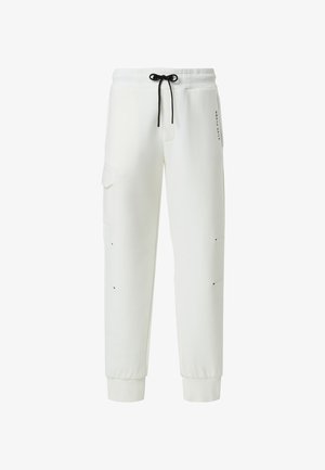 Weiße Jogginghose in entspannter Passform, mit einem Kordelzugbund, seitlichen Taschen und dezenten schwarzen Akzenten. Weicher Stoff, gerippte Bündchen.