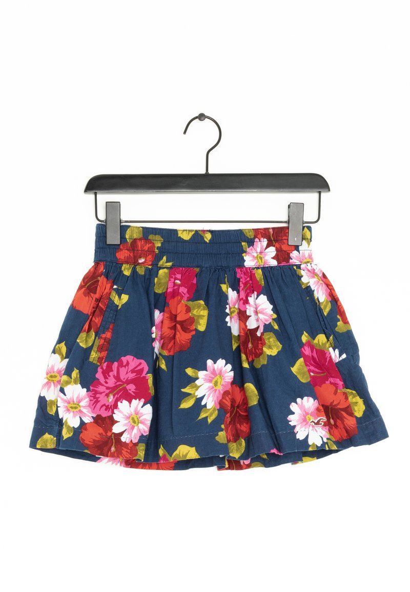 A navy floral skirt with a gathered waist, featuring large red and pink flowers. Made of lightweight fabric, it has pleats for added volume.
