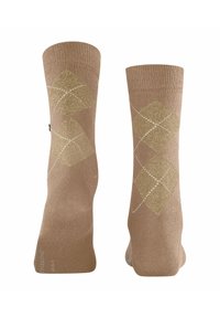 Calzini beige con una finitura testurizzata, caratterizzati da un motivo argyle in oro e bianco. Cuffs rinforzati e punte senza cuciture per un maggiore comfort.