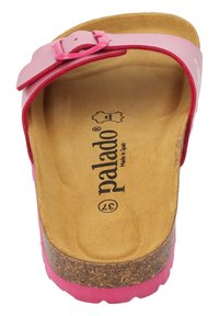 Rosa korkklämd sandal med en bred rem och spänne. Har en mjuk, tan-färgad innersula och en texturerad gummisula. Märkt med "palado."