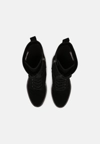 Tamaris Stivaletti con plateau - black