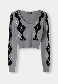 Grå kort croppad tröja med V-ringning. Har svart och vit argyle-mönster på ärmarna. Mjuk stickad textur; ribbad nederkant och ärmslut.